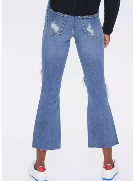 Vaqueros acampanados de tiro medio desgastados