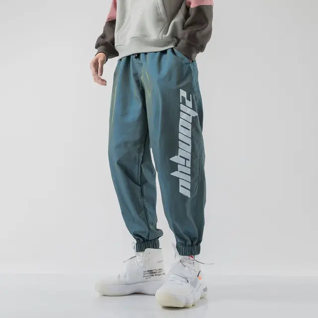 https://ae01.alicdn.com/kf/Sb26021935cbf4a36aac500a5672c24a3E/Hip-Hop-Trendy-Men-Casual-Reflective-Sweatpants-Spring-Autumn-Korean-Streetwear-Fashion-New-Baggy-Elastic-Waist.jpg_640x640.jpg