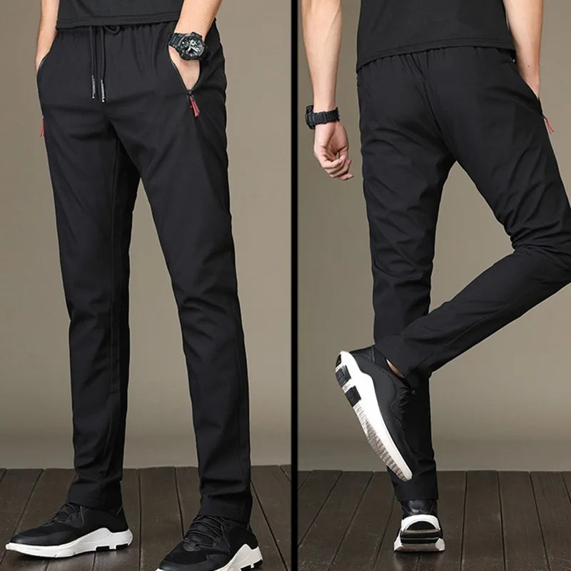https://ae01.alicdn.com/kf/S891c0cf258cc485bb74a13194afbbe7d2/Men-S-Zipper-Dry-Quick-Leisure-Pants-Mid-Waist-Casual-Versatile-Trend-Slim-Sports-Loose-Pants.jpg