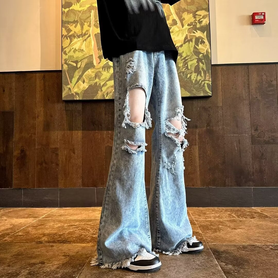 Vaqueros viejos rotos y lavados con copos de nieve de estilo americano