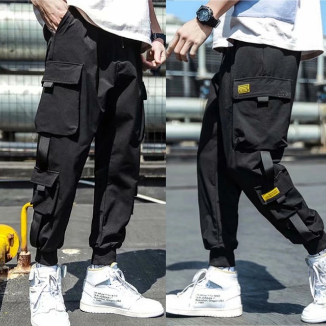 https://ae01.alicdn.com/kf/S5db5473aa8c9450f87c9ae09685af7050/2024-New-Fashion-Men-s-Cargo-Pants-Casual-Hip-Hop-Hit-Color-Multiple-Pockets-Trousers-Streetwear.jpg