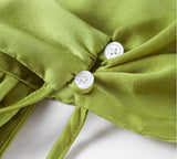 Lumina: Vestido de satén con cuello halter en color liso para primavera y verano.