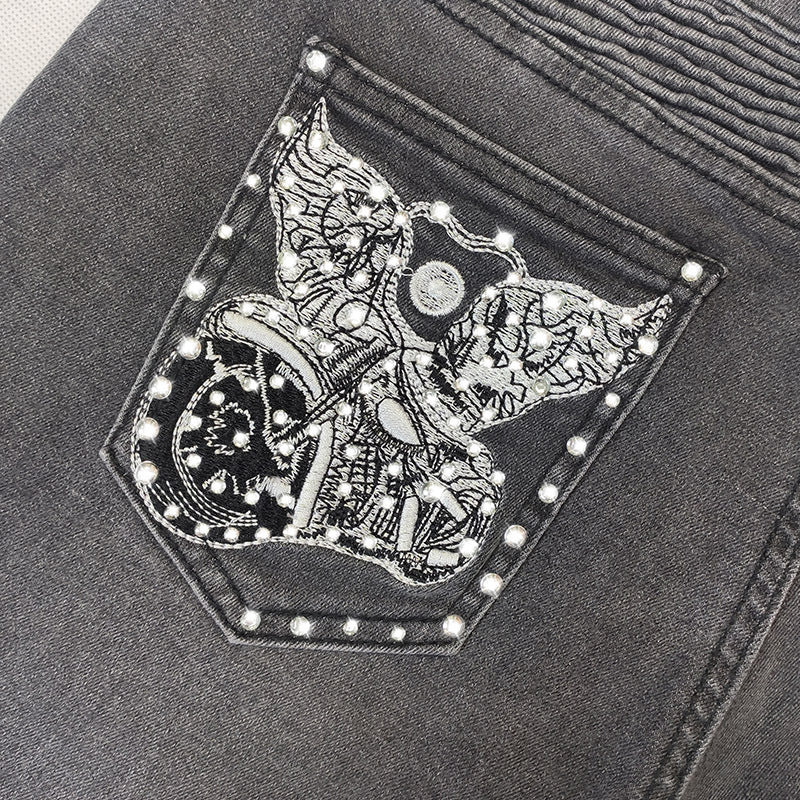 Pantalones vaqueros elásticos ajustados con bordado de motocicleta voladora para mujer