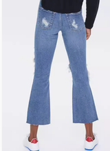 Vaqueros acampanados de tiro medio desgastados