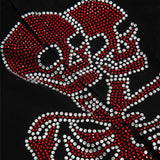 Vaqueros góticos con estampado de pedrería