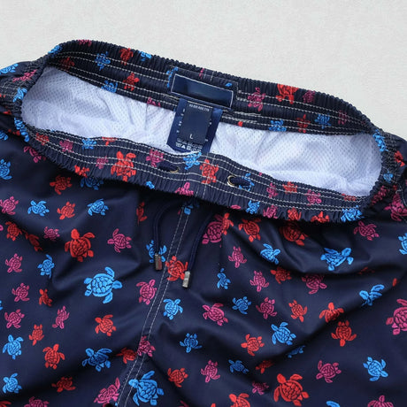 https://ae01.alicdn.com/kf/S57732d4ea1c847deb1158d481486a52bZ/High-Quality-Summer-New-Styley-Beach-Surf-Swimwear-Multicolore-Turtles-4-Way-Stretch-Printed-Board-Shorts.jpg