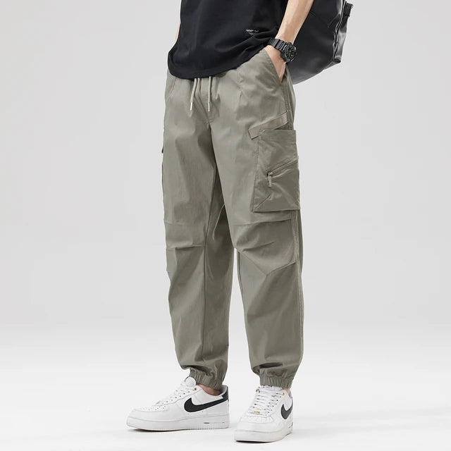 https://ae01.alicdn.com/kf/Se788178a1fb74866b2cb4df3fa60aefb7/Hip-Hop-Streetwear-Cargo-Pants-Spring-Summer-Casual-Pans-Men-Streetwear-Solid-Color-Pants-Elastic-Waist.jpg_640x640.jpg