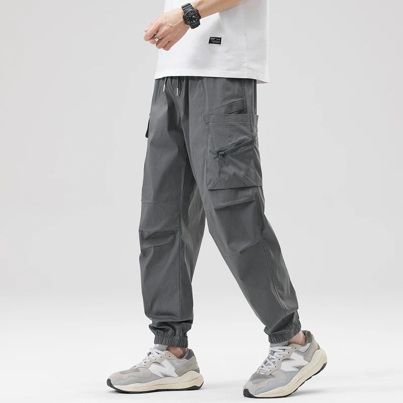 https://ae01.alicdn.com/kf/Sb4dcf84e2e93423f8f57fbb7ac1aa8b2z/Hip-Hop-Streetwear-Cargo-Pants-Spring-Summer-Casual-Pans-Men-Streetwear-Solid-Color-Pants-Elastic-Waist.jpg
