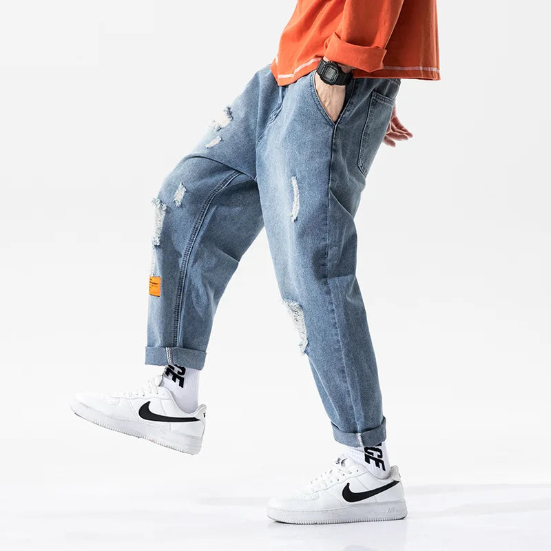 https://ae01.alicdn.com/kf/H0864a8ecc79d46f9aa0bae0fc7e489adw/Kx-8801-moda-kentsel-erkekler-delik-kot-Hip-Hop-moda-Streetwear-gev-ek-t-m-ma.jpg