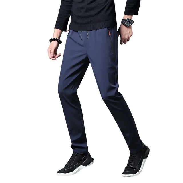 https://ae01.alicdn.com/kf/S870792086d7c48b7ab5f92934aa779edH/Men-S-Zipper-Dry-Quick-Leisure-Pants-Mid-Waist-Casual-Versatile-Trend-Slim-Sports-Loose-Pants.jpg_640x640.jpg