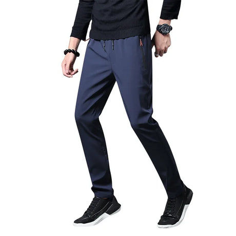 https://ae01.alicdn.com/kf/S870792086d7c48b7ab5f92934aa779edH/Men-S-Zipper-Dry-Quick-Leisure-Pants-Mid-Waist-Casual-Versatile-Trend-Slim-Sports-Loose-Pants.jpg_640x640.jpg