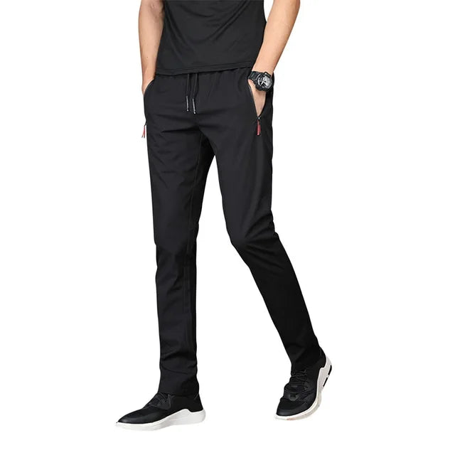 https://ae01.alicdn.com/kf/Sef561cf3e3e94a7ba26249082fb3b47cg/Men-S-Zipper-Dry-Quick-Leisure-Pants-Mid-Waist-Casual-Versatile-Trend-Slim-Sports-Loose-Pants.jpg_640x640.jpg