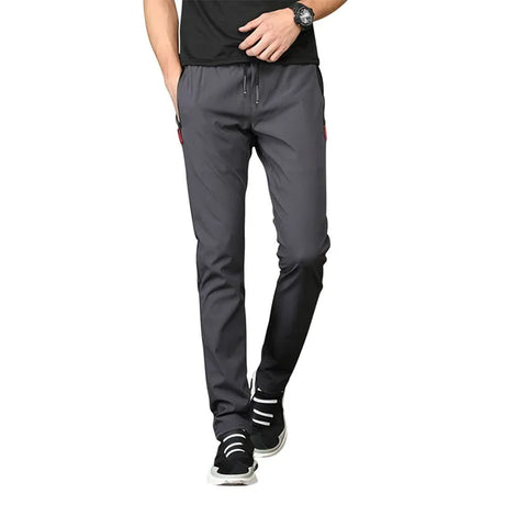https://ae01.alicdn.com/kf/S5cb766a9557745bea3e5c421043588b7i/Men-S-Zipper-Dry-Quick-Leisure-Pants-Mid-Waist-Casual-Versatile-Trend-Slim-Sports-Loose-Pants.jpg_640x640.jpg