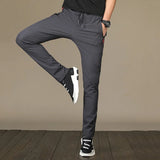 https://ae01.alicdn.com/kf/S5f8e035ee6c14a09a8c25a2ae0d51826i/Men-S-Zipper-Dry-Quick-Leisure-Pants-Mid-Waist-Casual-Versatile-Trend-Slim-Sports-Loose-Pants.jpg