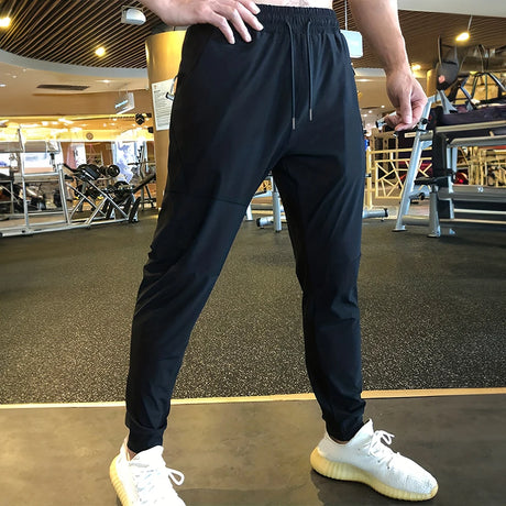https://ae01.alicdn.com/kf/S8b029472487741a0b94d96aa163af286l/Men-s-Pants-Summer-Thin-Sports-Casual-Pants-Harajuku-Streetwear-Fitness-Jogging-Outdoor-Running-Training-Sweatpants.jpg