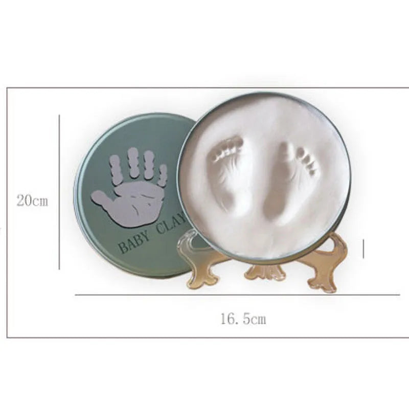 https://ae01.alicdn.com/kf/H3e18b971d0da49deb9b11810f9d5d06a2/Newborn-Baby-Hand-Foot-Print-Hands-Feet-Baby-Photo-Frame-DIY-Handprint-With-Cover-Fingerprint-Mud.jpg