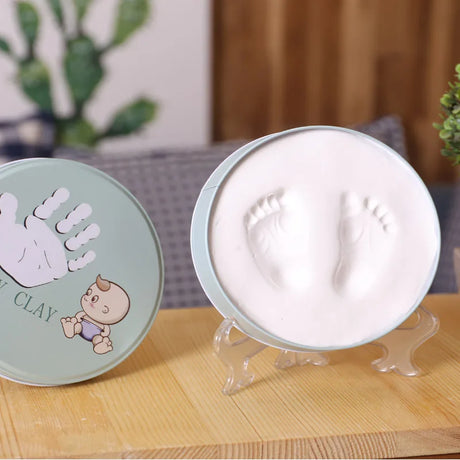 https://ae01.alicdn.com/kf/H2fb02da7b06e4782bd1450cde86d146bL/Newborn-Baby-Hand-Foot-Print-Hands-Feet-Baby-Photo-Frame-DIY-Handprint-With-Cover-Fingerprint-Mud.jpg