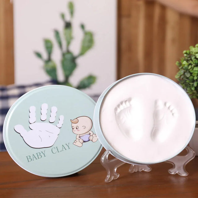 https://ae01.alicdn.com/kf/H23789e61563f44dda36048610a891529t/Newborn-Baby-Hand-Foot-Print-Hands-Feet-Baby-Photo-Frame-DIY-Handprint-With-Cover-Fingerprint-Mud.jpg