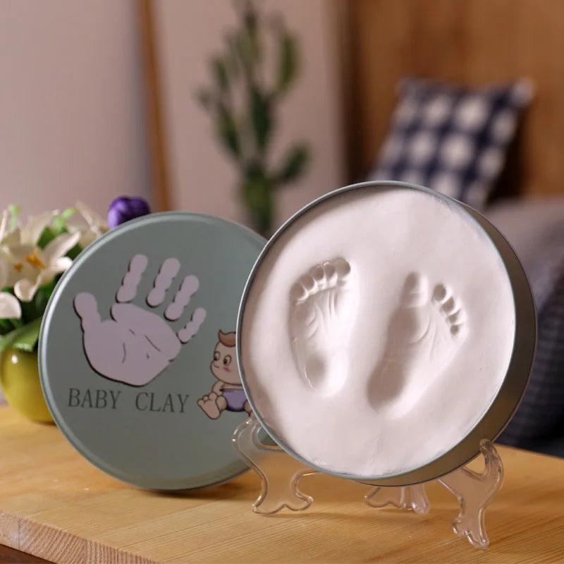 https://ae01.alicdn.com/kf/H72c35b90398044c7aaf6af617aa4f7138/Newborn-Baby-Hand-Foot-Print-Hands-Feet-Baby-Photo-Frame-DIY-Handprint-With-Cover-Fingerprint-Mud.jpg