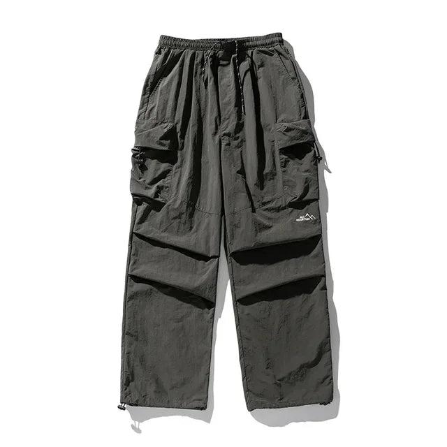 https://ae01.alicdn.com/kf/Sa4d2f86dcdc948ffbdc293dc1f9e395cm/TINT-ERA-Parachute-Cargo-Pants-Men-Oversize-Outdoor-Casual-Trousers-Male-Waterproof-Pants-Man-Japanese-Streetwear.jpg_640x640.jpg