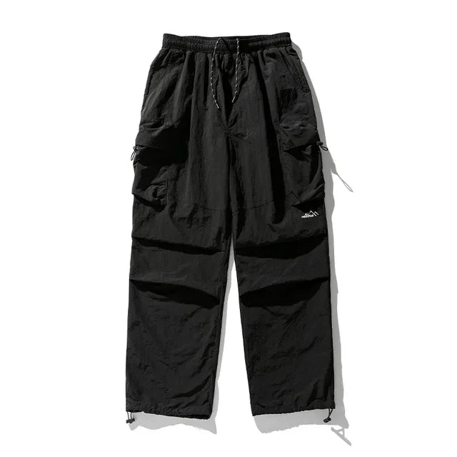 https://ae01.alicdn.com/kf/S0b2cd0585a61427f846f3d8aa1a98c62m/TINT-ERA-Parachute-Cargo-Pants-Men-Oversize-Outdoor-Casual-Trousers-Male-Waterproof-Pants-Man-Japanese-Streetwear.jpg_640x640.jpg