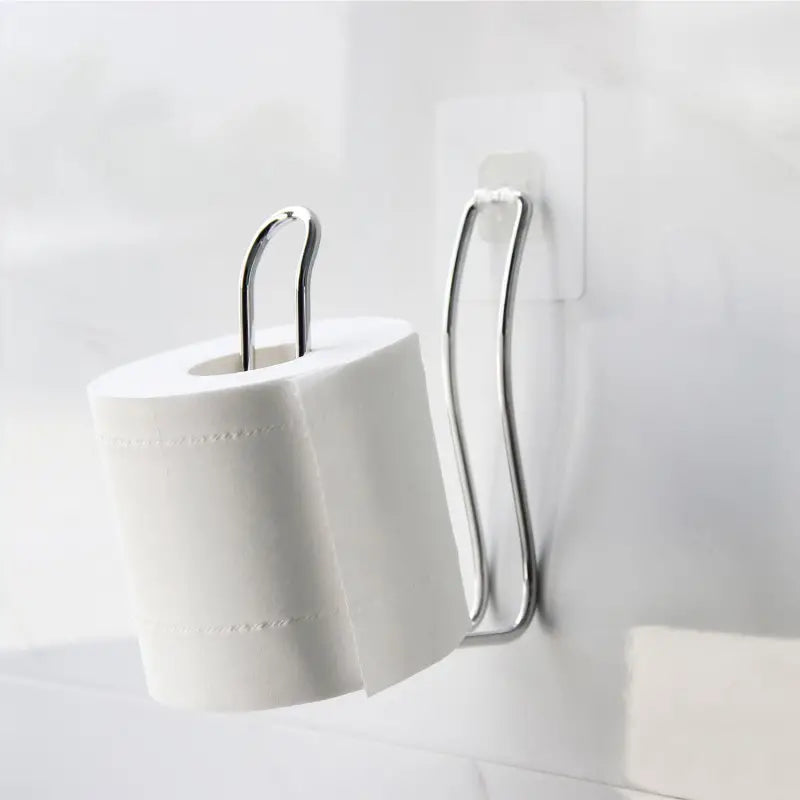 Porta rollo para papel higiénico sobre tanque de baño