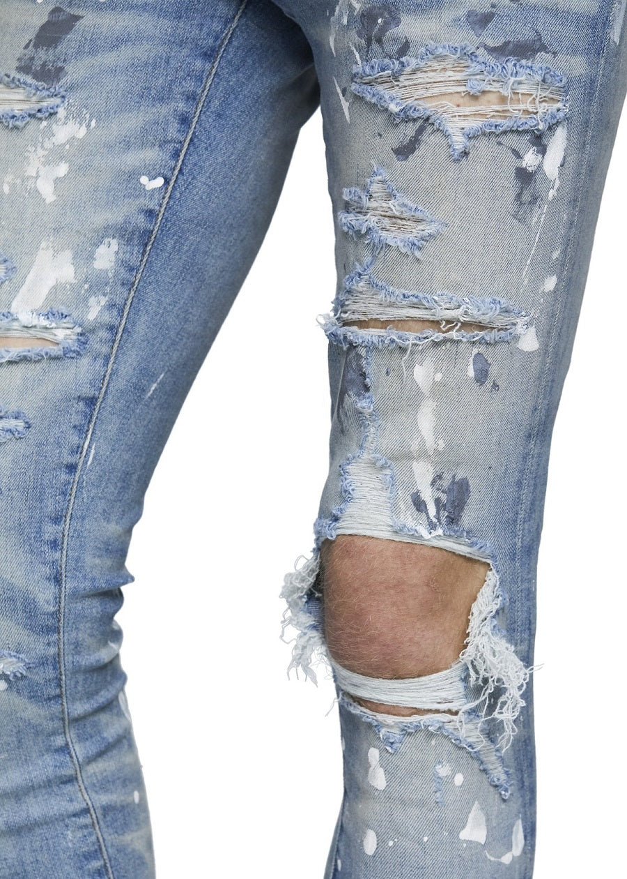 Vaqueros ajustados elásticos con lavado antiguo y grafiti rasgado para hombre