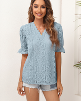 Blusa rosa con mangas de encaje